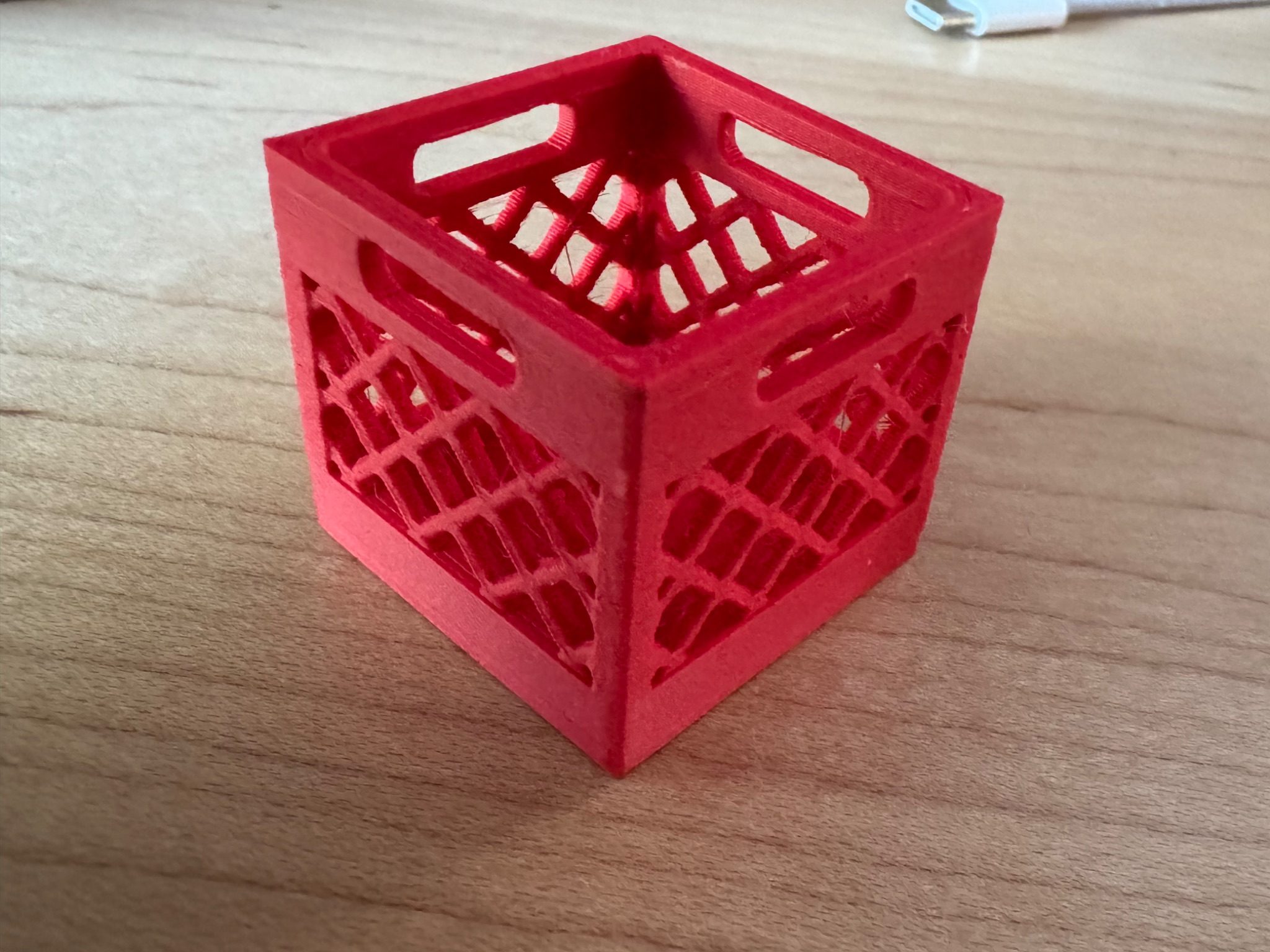 A miniature milk crate holding full-size SD cards upright